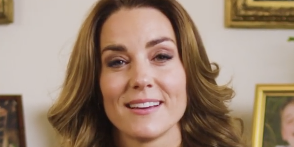 Kate Middleton Suits Up in a Sleek Navy Blazer Layered over a Salmon-Colored Sweater