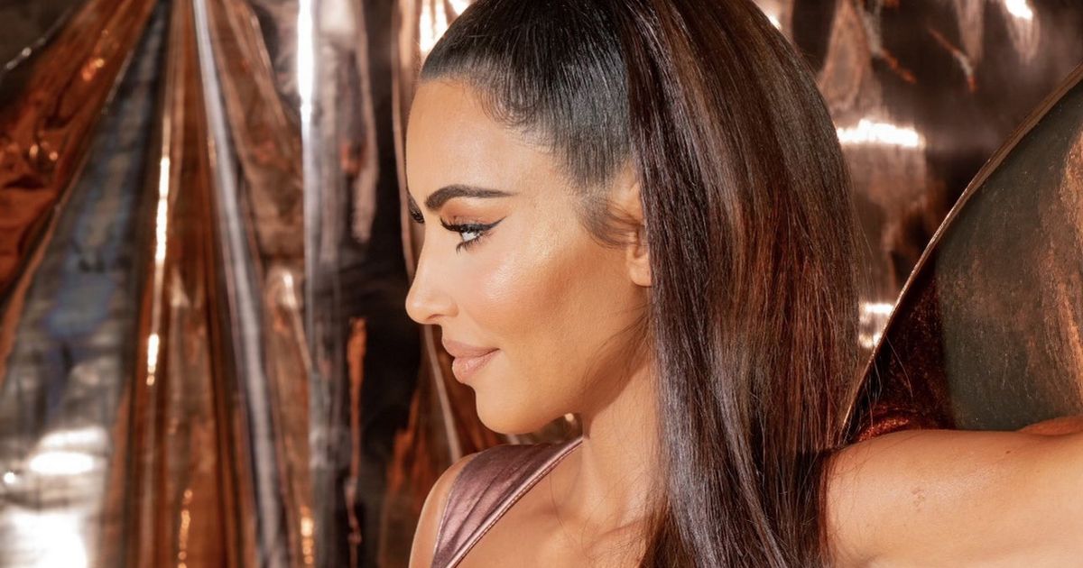 Kim Kardashian bares her famous bum in leather jumpsuit designed to show it off