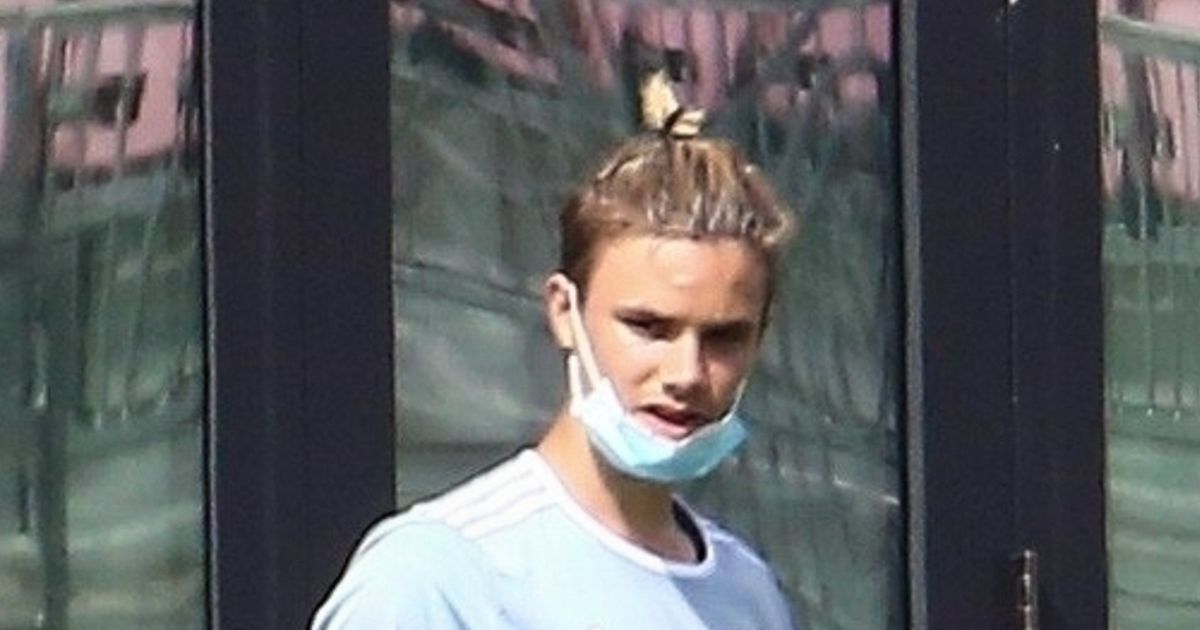 Romeo Beckham, 18, is dad David’s double as he shows off large new leg tattoo on pitch